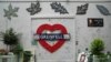 FILE - A view of the memorial wall at the Grenfell Tower in which 72 people were killed in a fire in 2017, in London, Sept. 2, 2024.