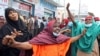 Somali women react at a protest against the African Union Mission in Somalia outside the Erdogan Hospital following the killing of civilians during a gunfight between AMISOM and al-Shabab fighters in the Lower Shabelle region, in Mogadishu, Aug. 12, 2021.