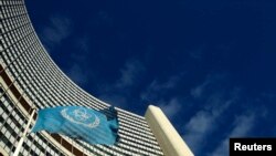 FILE - The flag of the International Atomic Energy Agency flies in front of its headquarters in Vienna, Austria.
