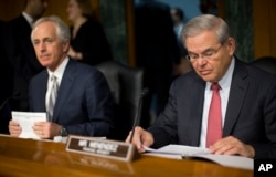 FILE - Senate Foreign Relations Committee Chairman Bob Corker, left, and ranking member Robert Menendez express concern about upheaval in Yemen.