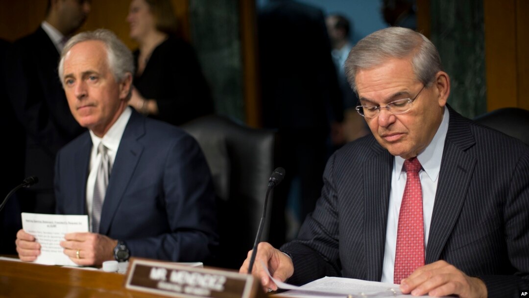 Senate Foreign Relations Committee Chairman Sen. Bob Corker, R-Tenn., left, and the committee's ranking member, Sen. Robert Menendez, D-NJ., prepare for the committee's hearing on Capitol Hill in Washington, March 11, 2015. 