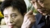 Gu Kailai, left, wife of then Chinese Commerce Minister Bo Xilai, right, attends a memorial ceremony for Bo's father at a military hospital in Beijing, January 17, 2007.