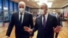 FILE - Turkish Foreign Minister Mevlut Cavusoglu (R) speaks with Greek Foreign Minister Nikos Dendias as they arrive to the press conference following their meeting in Ankara, Apr. 15, 2021. 