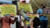 FILE - A protester shouts slogans during a rally outside the Chinese consulate in Metro Manila, Philippines on May 7, 2021. 
