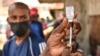 FILE - A health official prepares the Moderna Covid-19 vaccine during a mass Covid-19 vaccination drive in Nairobi, Kenya, Sep. 17, 2021.