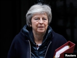 FILE - Britain's Prime Minister Theresa May leaves 10 Downing Street in London, Britain, Nov 21, 2018.