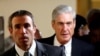 FILE - Special Counsel Robert Mueller (R) departs after briefing members of the U.S. Senate on his investigation into potential collusion between Russia and the Trump campaign on Capitol Hill in Washington, U.S., June 21, 2017. 