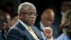 FILE - Uganda's then-prime minister, Amama Mbabazi, speaks at the World Economic Forum on Africa in Cape Town, South Africa, May 9, 2013. 