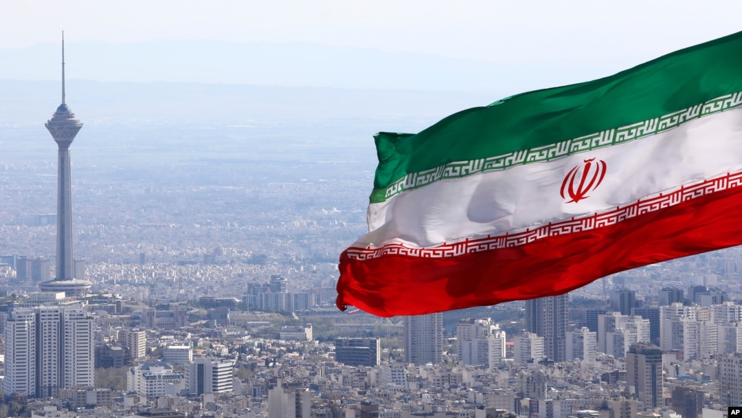 FILE - Iran's national flag flies over Tehran, Iran, March 31, 2020. 