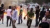 FILE - Supporters of the Muslim Brotherhood set things aflame to block a street during clashes with Egyptian forces following their protest against the government in Cairo's Matariya district, Egypt, June 30, 2015. 
