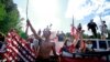 FILE - Native American protesters form a roadblock on the road leading to Mount Rushmore ahead of President Donald Trump's visit to the memorial on July 3, 2020, in Keystone, S.D. 