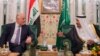 FILE - Iraqi Prime Minister Haider al-Abadi, left, meets with Saudi King Salman in Jiddah, Saudi Arabia, June 19, 2017.