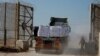 A truck carries humanitarian aid destined for the Gaza Strip, amid the ongoing conflict in Gaza between Israel and Hamas, at the Kerem Shalom crossing in southern Israel, Nov. 11, 2024.