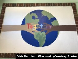 "Peacekeepers" at a Montessori school made this mural after a workshop with "Serve to Unite" - the organization started by the son of one of the victims of the 2012 shooting.
