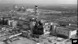 FILE - A 1986 photo offers an aerial view of the Chernobyl nuclear plant in Chernobyl, then-Soviet Ukraine, showing damage from an explosion and fire in reactor four on April 26, 1986.