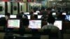 FILE - Customers surf the Internet at an Internet cafe in Beijing, China.