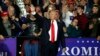 U.S. President Donald Trump waves after a campaign rally in Washington Township, Michigan, April 28, 2018.