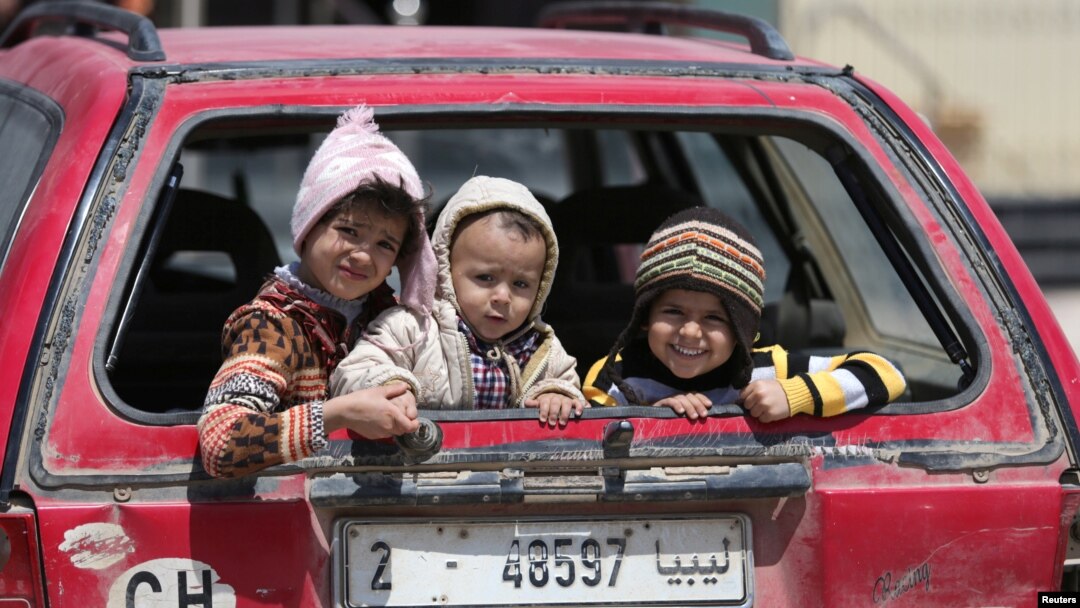 Children sit in a car in Benghazi, Libya, April 22, 2017. UNICEF says nearly 200,000 children in Libya need clean water, and more than 300,000 need educational support.
