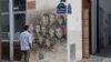 A man looks at a painting by French street artist Christian Guemy, aka "C215," in Paris, France, Sept. 2, 2020, in tribute to the members of the satirical newspaper Charlie Hebdo attacked by jihadist gunmen in January 2015.