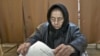 An elderly woman casts a ballot in Sintesti, Romania, Sunday, December 9, 2012. 