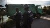 Cameroonian police officers check a truck in Buea on Oct, 7, 2018. Human Rights Watch says police often target sexual minorities for abuse. 