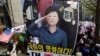 Supporters of former South Korean President Park Geun-hye with her portrait stage a rally to call for her release near the Seoul Central District Court in Seoul, South Korea, April 6, 2018. 