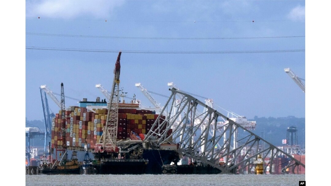FILE - The collapsed Francis Scott Key Bridge rests on the container ship Dali in Baltimore, Maryland, May 12, 2024.