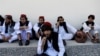 FILE - Newly freed Taliban prisoners sit at Pul-i-Charkhi prison, in Kabul, Afghanistan, May 26, 2020. 