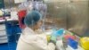 FILE - This Feb. 23, 2017, photo shows a worker inside the P4 laboratory in Wuhan, capital of China's Hubei province.