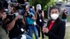 FILE - Rappler CEO Maria Ressa stands in front of reporters outside the Court of Tax Appeals in Manila, Philippines, March 4, 2021. She testified in response to four counts of tax evasion and failure to file accurate tax returns. 