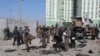Afghan security personnel investigate at the site of a bomb attack in Kabul, Afghanistan, Dec. 15, 2020. A bombing and a shooting attack on Tuesday killed several people, including Kabul's deputy governor. 
