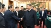 2025年2月17日，中國國家主席習近平在北京出席民營企業座談會時與民營企業家代表握手。