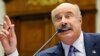 FILE - Dr. Phil McGraw, television personality and psychologist, speaks at a hearing US House committee hearing in Washington, June 24, 2010.
