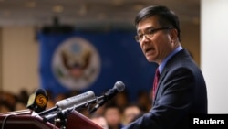 U.S. Ambassador Gary Locke delivers a farewell speech at Beijing American Center in Beijing, Feb. 26, 2014.