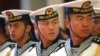 FILE - Members of a military honor guard are seen at People's Liberation Army Navy headquarters outside Beijing, China, July 15, 2014. Despite tensions over China's territorial claims over the South China Sea, Beijing and Washington continue to engage in