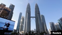 FILE - Roads are deserted during a lockdown due to the coronavirus outbreak, in Kuala Lumpur, Malaysia, June 1, 2021. 