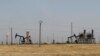 FILE - An oil field controlled by the Kurdish-led Syrian Democratic Forces (SDF) is seen northeast Syria, July 30, 2017.