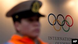 Police officer guards hotel where International Olympic Committee executive board is meeting, Buenos Aires, Argentina, Sept. 5, 2013.