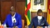 C.A.R. minister of Transport and Civil Aviation, Arnaud Djoubaye- and Cameroon’s transport minister, Jean Ernest Messina Ngale Bibehe, Yaounde, Feb. 24, 2021. (Moki Edwin Kindzeka/VOA)