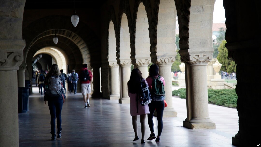 File -- Students walk on campus at Stanford University in Palo Alto, California in 2016.