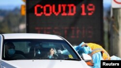 A member of the public is seen getting a test for the coronavirus disease (COVID-19) at the Crossroads Hotel testing centre following a cluster of infections in Sydney, Australia, July 16, 2020. (AAP Image/Bianca De Marchi via Reuters)