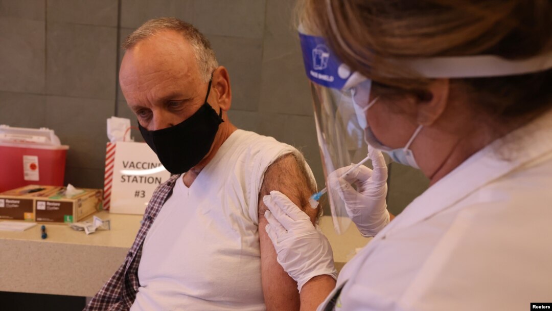 Hospital Chief Financial Officer Mitchell Thomas, 67, is given the coronavirus disease (COVID-19) vaccine at Martin Luther King Jr. Community Hospital, in South Los Angeles, California, U.S., December 17, 2020. REUTERS/Lucy Nicholson