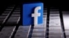 FILE - A 3-D-printed Facebook logo is seen on a keyboard in this illustration made March 25, 2020.
