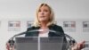 FILE - President of the French far-right party Rassemblement National (National Rally) and MP Marine Le Pen gives a press conference, in Paris, March 9, 2021. 