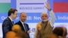 FILE - India's Prime Minister Narendra Modi waves as Russian President Vladimir Putin looks on after attending the India-Russia Business Summit in New Delhi, India, Oct. 5, 2018. 