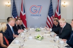 Britain's Prime Minister Boris Johnson meets U.S. President Donald Trump for bilateral talks during the G-7 summit in Biarritz, France Aug. 25, 2019.