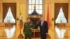 FILE - Myanmar's Army Commander and now the country's military leader, Gen. Min Aung Hlaing, left, and Chinese Foreign Minister Wang Yi pose for a photo during their meeting in Naypyitaw, Myanmar, Jan. 12, 2021. (Myanmar Military Information Team via AP)