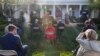 Reporters are seated a social distance apart as President Donald Trump speaks about the coronavirus in the Rose Garden of the White House, April 15, 2020, in Washington.