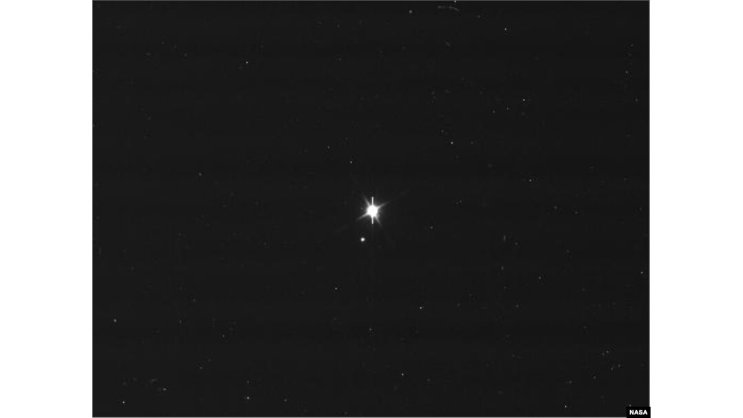This image of Earth and the moon was taken by NASA's Cassini spacecraft on July 19, 2013. Image Credit: NASA/JPL-Caltech/Space Science Institute