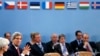 U.S. Secretary of State John Kerry (L) attends a NATO foreign ministers meeting in Brussels December 3, 2013.